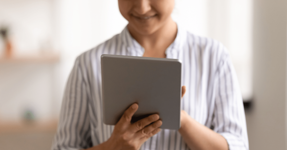 peaceful person looking at digital tablet